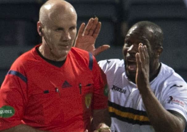 Dumbarton's Christian Nade (right) appeals to referee Steven Finnie having gone to ground. Picture: SNS