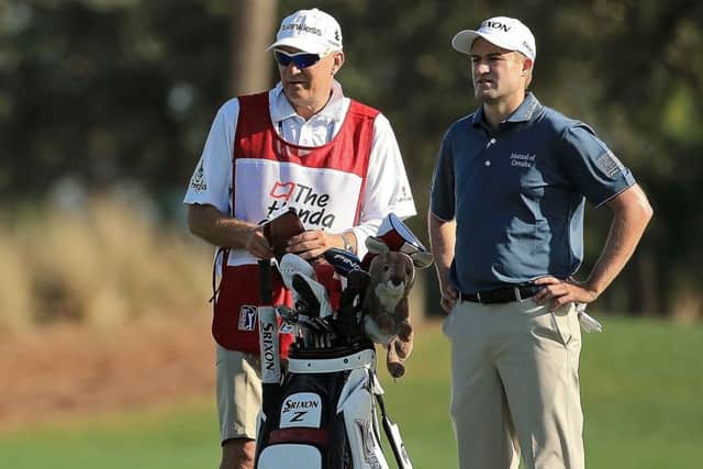 Russell Knox and his caddie line up his approach on the 11th at the Honda Classic in Palm Beach. Picture: Getty
