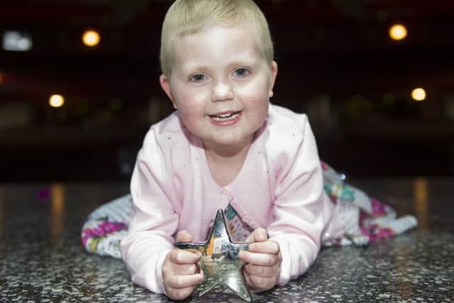 Five-year-old leukaemia patient Agatha King posing with her Kids & Teens Little Star Award after meeting the cast of Hairspray at the Edinburgh Playhouse. Picture: PA