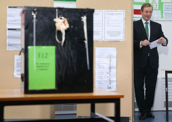 An Taoiseach Enda Kenny casts his vote at a polling station at St Anthony's School in Castlebar Picture: Brian Lawless/PA Wire