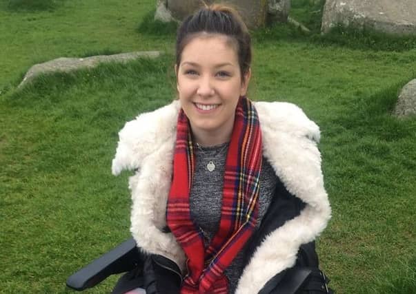 Lucy Lintott, 21, Scotland's youngest MND patient, pictured on a 'bucket list' trip to Stonehenge.