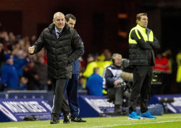 Rangers and Mark Warburton, left, hold a significant advantage over Hibs and Alan Stubbs. Picture: SNS