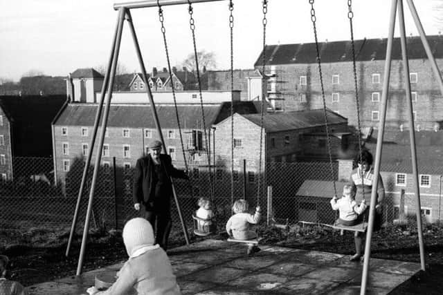 Glenkinchie Village, East Lothian, Children playing in playground