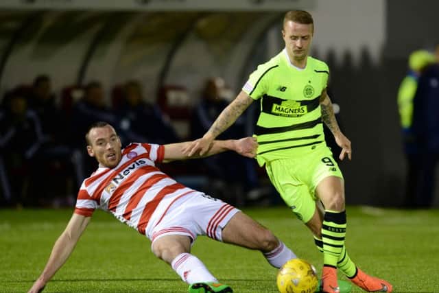 Hamilton's Darian MacKinnon (left) battles for the ball against Celtic's Leigh Griffiths. Picture: SNS Group