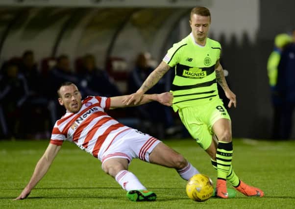 Hamilton's Darian MacKinnon (left) battles for the ball against Celtic's Leigh Griffiths. Picture: SNS Group