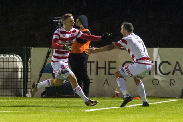 Hamilton's Eamonn Brophy, left, celebrates his equaliser against Celtic. Picture: Rob Casey/SNS