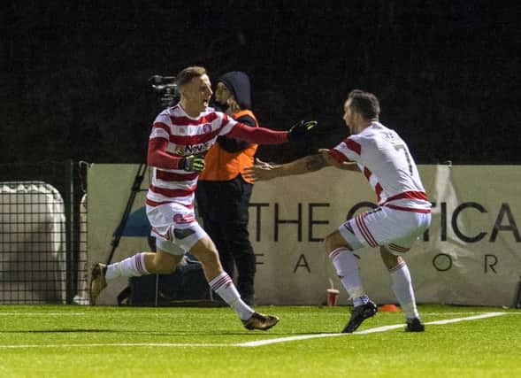 Hamilton's Eamonn Brophy, left, celebrates his equaliser against Celtic. Picture: Rob Casey/SNS