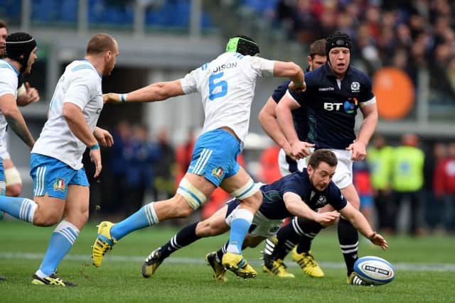 Scotland's Greig Laidlaw scrambles for a loose ball ahead of Italy's Francesco Minto. Picture: Andrew Matthews/PA Wire.