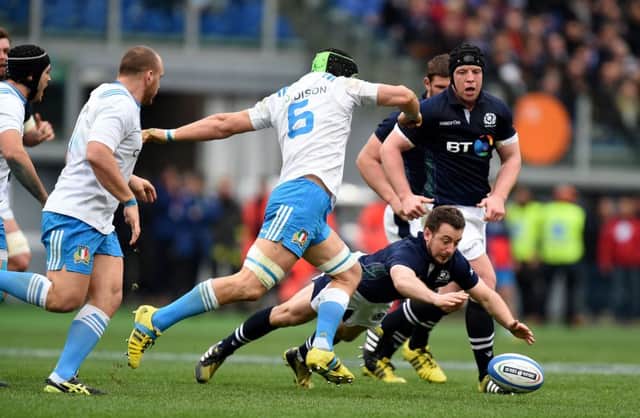 Scotland's Greig Laidlaw scrambles for a loose ball ahead of Italy's Francesco Minto. Picture: Andrew Matthews/PA Wire.