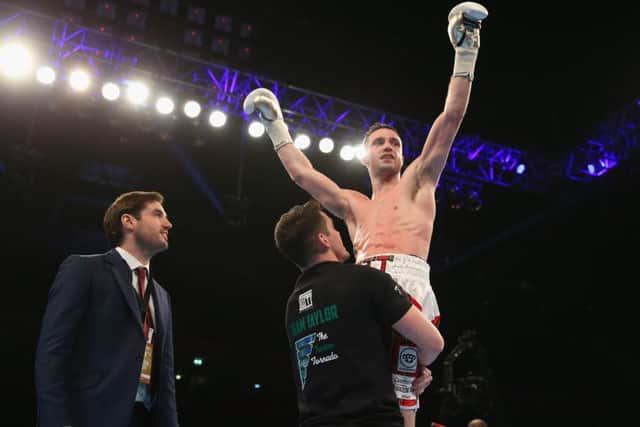 Josh Taylor celebrates his win over Lyes Chaibi last night. Picture: Alex Livesey/Getty