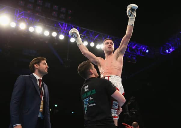 Josh Taylor celebrates his win over Lyes Chaibi last night. Picture: Alex Livesey/Getty