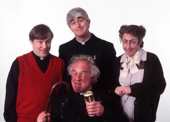 Frank Kelly, bottom, with the cast of Father Ted, from left, Ardal O'Hanlon, Dermot Morgan, and Pauline McGlynn