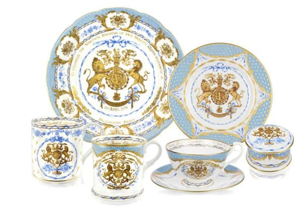 The Royal coat of arms is surrounded by flowers in the commemorative collection. Picture: PA