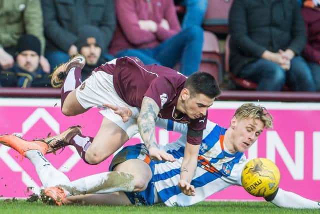 Hearts goalscorer Jamie Walker takes a tumble while challenged by Kilmarnocks Kevin McHattie at Tynecastle on Saturday. Picture: Ian Georgeson