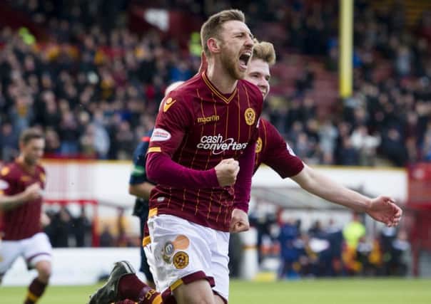 Lewis Moult (centre) celebrates after scoring Motherwell's first goal. Picture: SNS