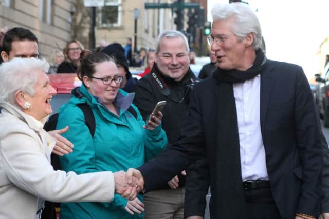 Richard Gere takes time out to greet his fans. Picture: Hemedia