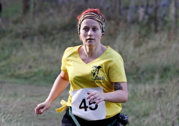 Amy McLaughlan competes in a 10k race, one of 10 events she ran in 100 days to raise money for brain tumour research. Picture: Contributed