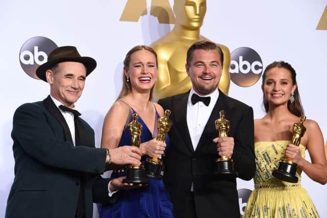 From left to right, Best Supporting Actor Mark Rylance, Best Actress Brie Larson, Best Actor Leonardo DiCaprio and Best Supporting Actress Alicia Vikander pose with their Oscar. Picture: AFP/Getty Images