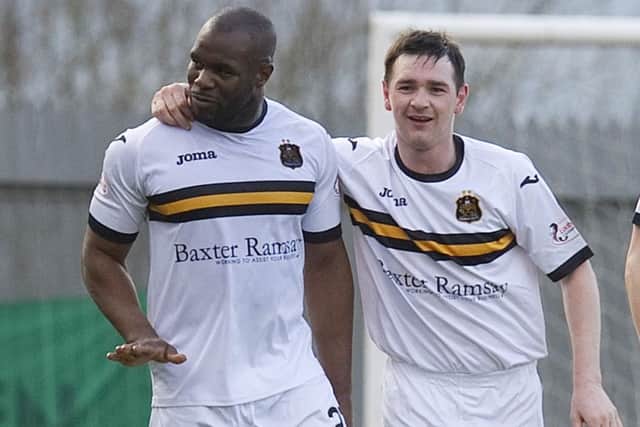 Dumbarton's Christian Nade (left) celebrates having doubled the lead for his side. Picture: SNS