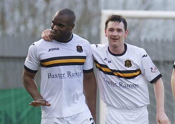 Dumbarton's Christian Nade (left) celebrates having doubled the lead for his side. Picture: SNS