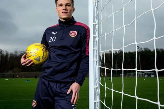 Hearts striker Gavin Reilly believes Hearts have over-achieved so far this season, yet are capable of climbing even higher. Picture: SNS