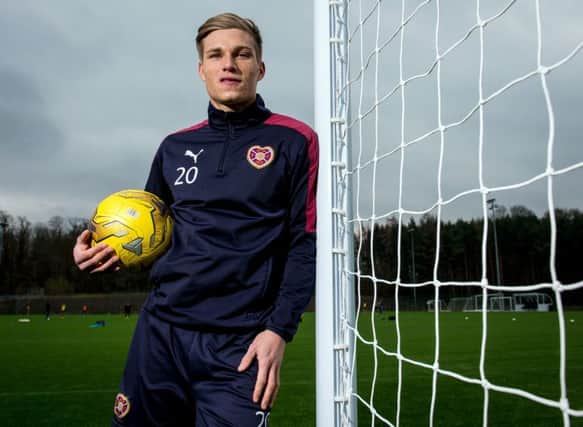 Hearts striker Gavin Reilly believes Hearts have over-achieved so far this season, yet are capable of climbing even higher. Picture: SNS