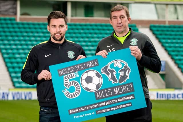 Defender Darren McGregor and manager Alan Stubbs help to promote a health initiative that is urging Hibs supporters to pick up free pedometers on match days and then try to walk 500 miles. Picture: SNS