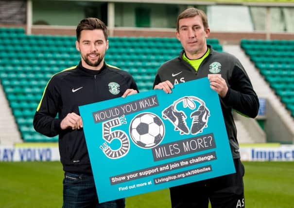 Defender Darren McGregor and manager Alan Stubbs help to promote a health initiative that is urging Hibs supporters to pick up free pedometers on match days and then try to walk 500 miles. Picture: SNS