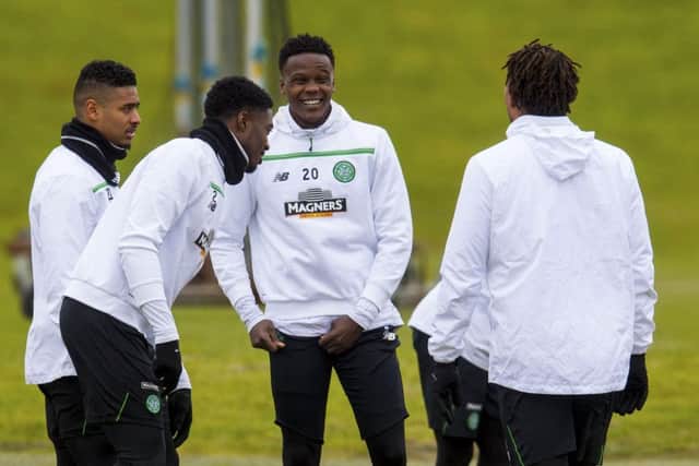 Celtics No 20 Dedryck Boyata looks relaxed with some of his team-mates in training at Lennoxtown. Picture: SNS