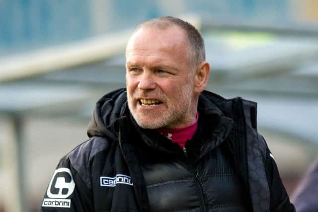 Hughes urged referee Alan Muir not to be intimidated by the Tynecastle crowd. Picture: SNS