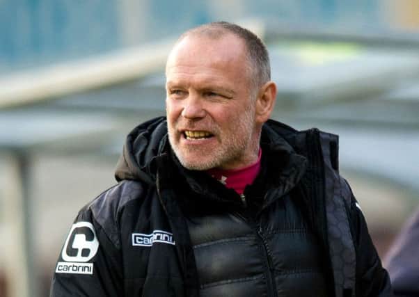Hughes urged referee Alan Muir not to be intimidated by the Tynecastle crowd. Picture: SNS