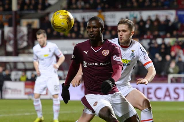 Hearts' Abiola Dauda battles for the ball against Inverness CT's Danny Devine. Picture: SNS