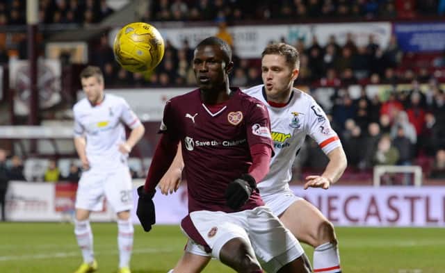 Hearts' Abiola Dauda battles for the ball against Inverness CT's Danny Devine. Picture: SNS