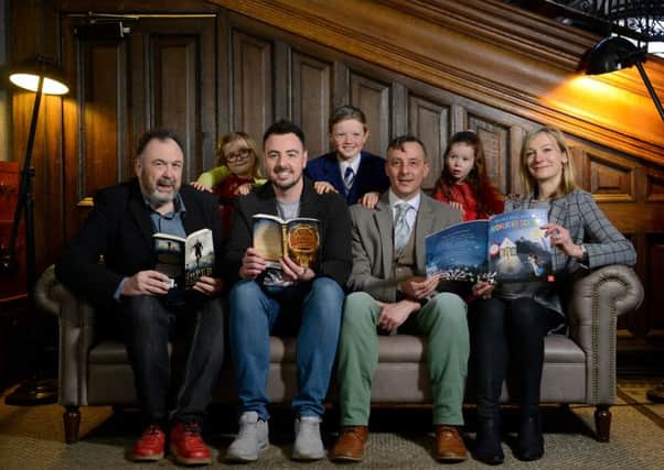 Winning writers of the Scottish Children's Book Awards 2016, from left to right, Danny Weston (The Piper), Ross MacKenzie (The Nowehere Emporium), Simon Puttock and illustrator Ali Pye (both created Mouse's First Night at Moonlight School), at the Central Hotel, Glasgow. In the back row are 
Maggie, 4, Jack, 10 and Orla, 4, who judged the books. Picture: Hemedia