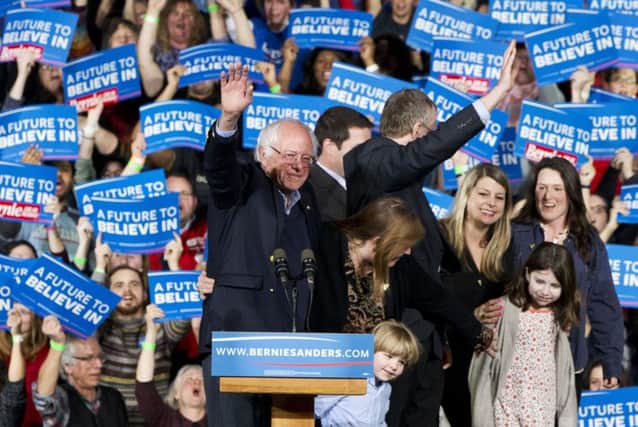 Vermont senator Bernie Sanders, who presents himself as a democratic socialist, waves to the crowd during a rally yesterday. Picture: AP