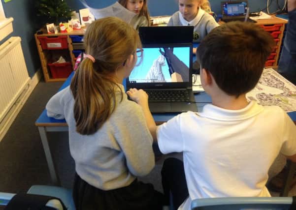 Children get stuck into video game Minecraft which has created a digital version of Jupiter Artland. Picture: Jupiter Artland