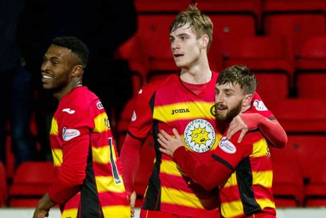 Partick Thistle's Steven Lawless (right) celebrates his side's second. Picture: SNS