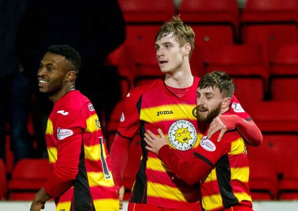 Partick Thistle's Steven Lawless (right) celebrates his side's second. Picture: SNS