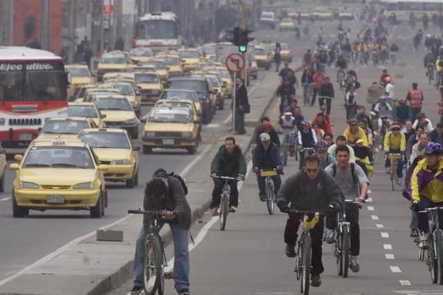 Commuters in Bogota, Colombia. IndigoVision is involved in 'safe city' projects across the South American country. Picture: AP Photo/Ricardo Mazalan