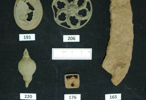 Horseshoe fragment (165), harness boss (206), pendant (191), sword belt fitting (220), and shoe buckle (176). Picture: Transport Scotland