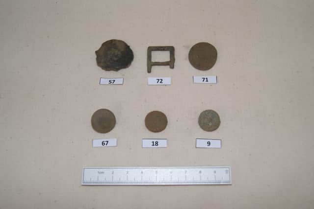 Possible seventeenth century buckle and buttons. Picture: Transport Scotland