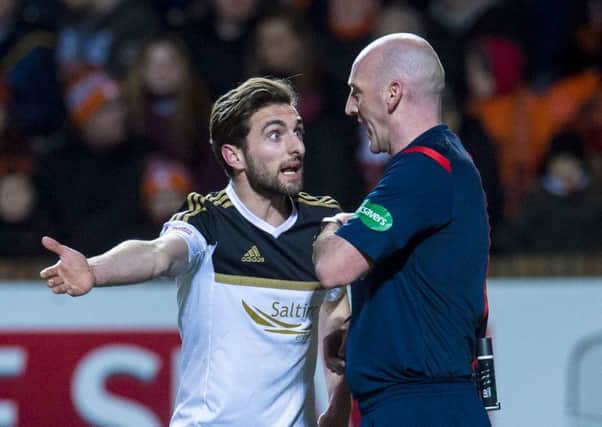 Aberdeen's Graeme Shinnie (left) appeals to referee Bobby Madden after being booked. Picture: SNS