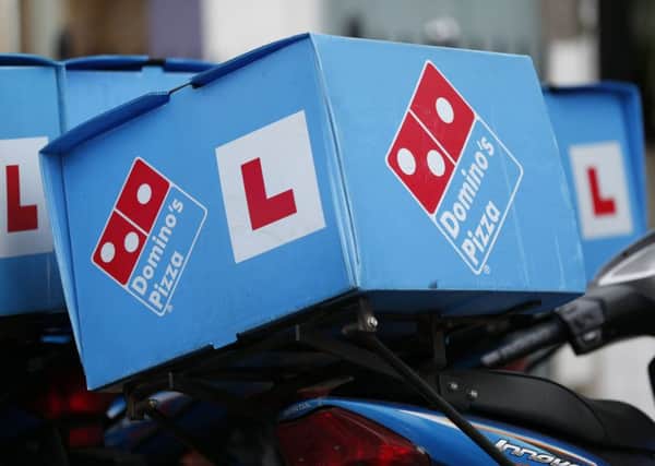 Domino's said its bottom line was helped by cheaper cheese, fuel and dough. Picture: Jonathan Brady/PA Wire