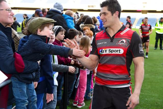 Edinburghs Phil Burleigh is congratulated by fans at Murrayfield after last weekends win over the Scarlets. Picture: SNS