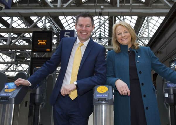 Transport Minister Derek Mackay (left) helps launch ScotRail's Smartcards system. Picture: PA