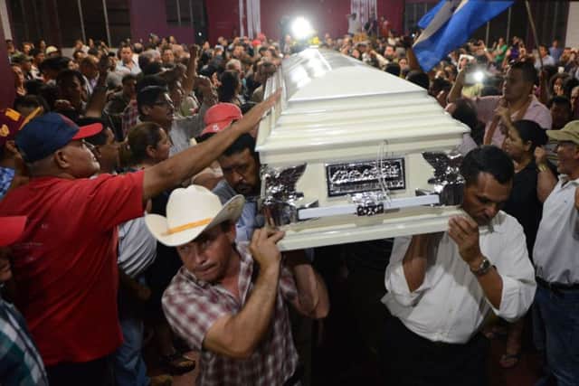 Relatives and friends carry the coffin of murdered indigenous activist Berta Caceres during her funeral in La Esperanza, 200 km northwest of Tegucigalpa. Photo Getty Images