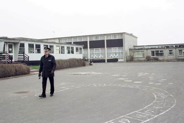 A police officer in the playground of Dunblane Primary School a day after the shooting. Picture: PA
