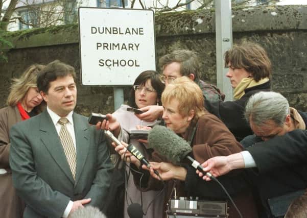 Ron Taylor speaking to reporters on March 22, 1996 - the day pupils returned following the massacre. Picture: PA