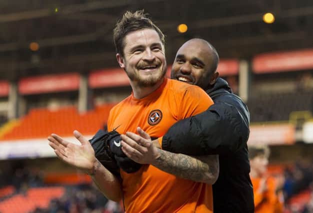 Hatching escape plan: Paul Paton, left, celebrates with Florent Sinama-Pongolle after the defeat of Hearts. Picture: Craig Foy/SNS
