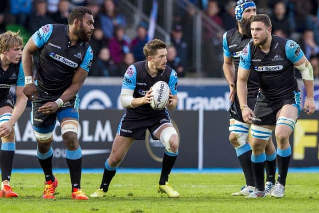 Centre of attention: Well, hes a scrum-half actually but Henry Pyrgos, ball in hand,  is very much the focus for his Glasgow team-mates as they prepare to face Cardiff at Scotstoun today. Picture: Gary Hutchison/SNS